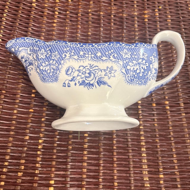 Festival Blue Gravy Boat made by Spode in England, featuring a blue and white transferware design with a turkey motif on...