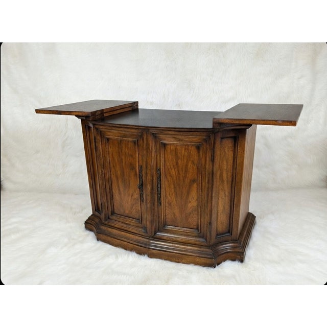 Vintage Century Furniture flip-top server buffet in a walnut-tone finish. A "Century Furniture of Distinction" stamp is...