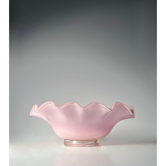 A Large Murano Glass oval bowl with ruffled edge by Barovier &amp; Toso. Beautiful Pink Color with Gold overlay.