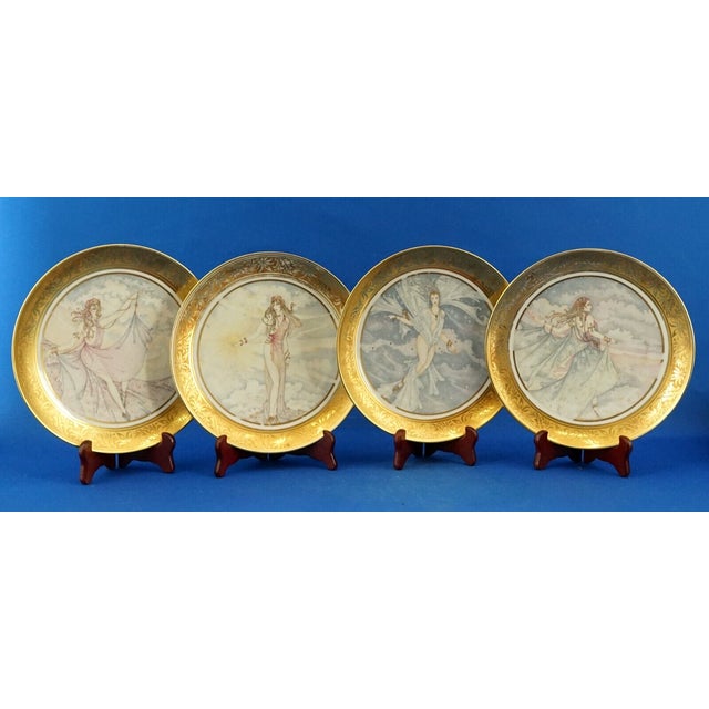 Item description: Set of four wall plates, made of fine hard-paste porcelain, featuring four Art Nouveau ladies and a pure...