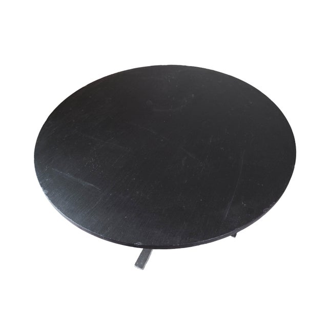 Round coffee table with black slate plate and designed by Sigurd Ressell Falcon. The table is in great vintage condition....