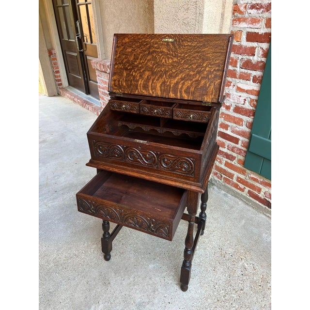 Antique English Slant Front Desk Display Stand Jacobean Carved Tiger Oak Lectern. Direct from England, a striking antique...