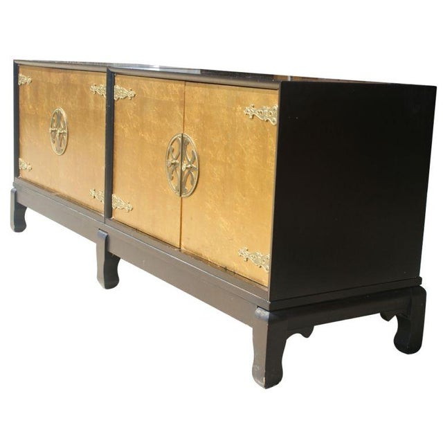 A double cabinet made by Johnson Furniture with the design attributed to Renzo Rutili. Two black lacquer cabinets with...