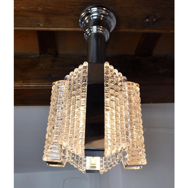 Very beautiful and rare Kaiser Leuchten chandelier designated and produced in Germany in the 1960s. Chromed metal...