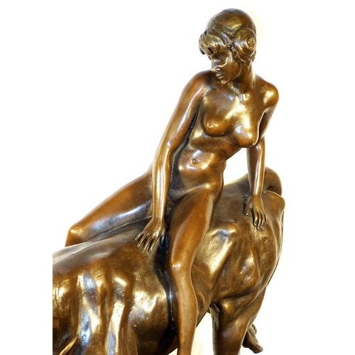 Art Nouveau bronze sculpture depicting Europa seated on the back of a powerful bull, in a warm gilt bronze patina. This is...