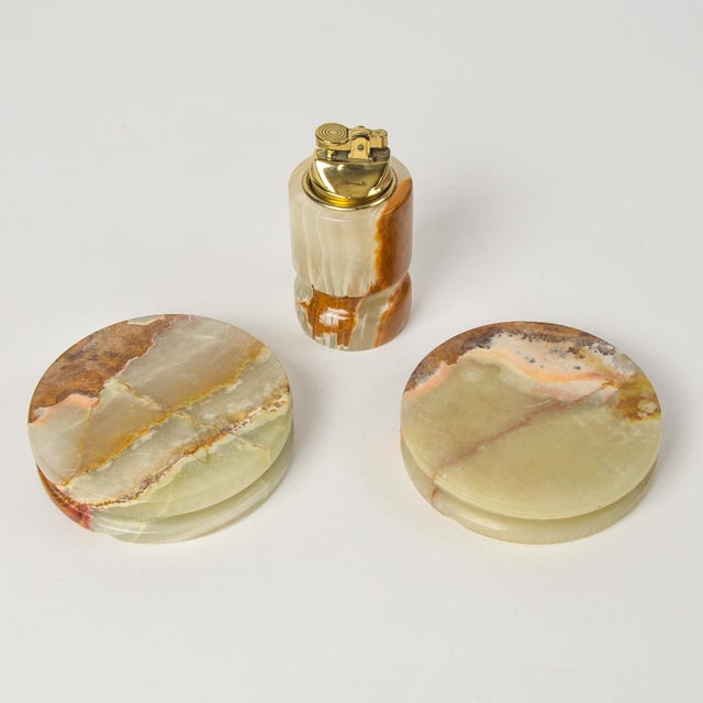 A gorgeous vintage onyx lighter and ashtray pair. Beautiful greenish grey with brown veining. Lighter is heavy and feels...