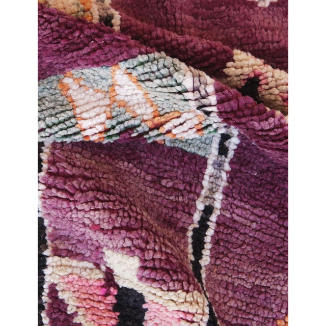 Highly Collectible Authentic Moroccan Rug – Plum Field with Symbolic Motifs This highly collectible authentic Moroccan rug...