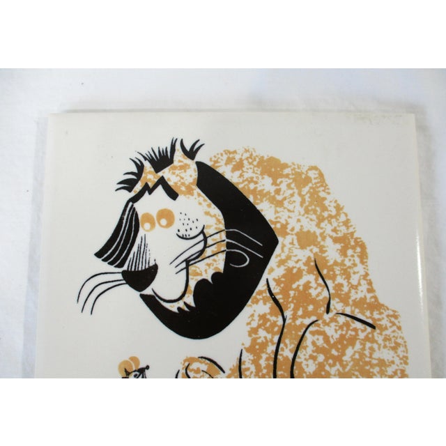 A prototype Mid Century tile of a Lion with a mouse manufactured by the Mosaic Tile Company Zanesville Ohio. Attributed to...