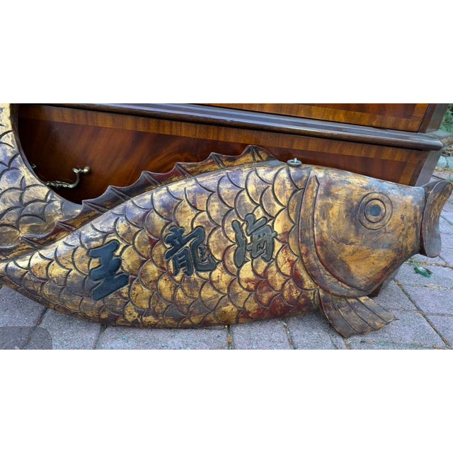 A vintage hand carved wooden fish wall hanger , translates to Chinese Dragon King .