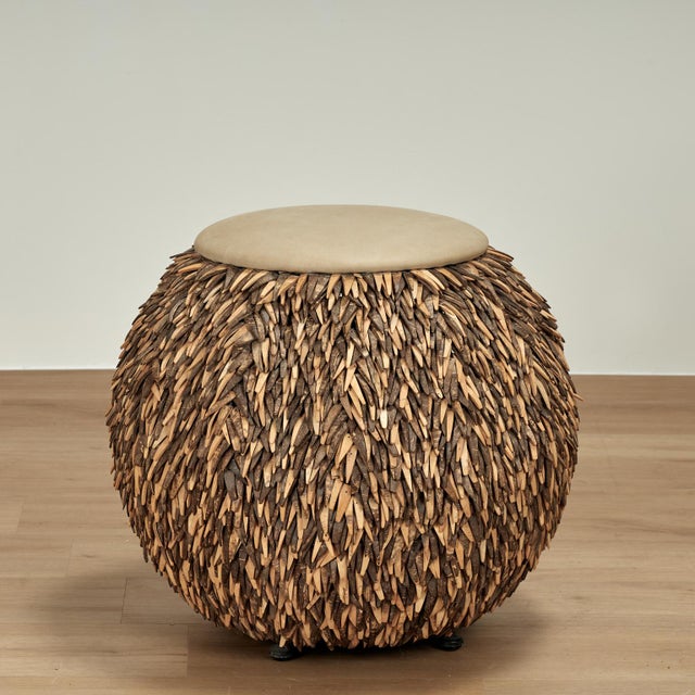 Decorative pair of vintage ottomans crafted in a busy composition of leather strips over a metal frame in a sea urchin...
