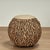 Decorative pair of vintage ottomans crafted in a busy composition of leather strips over a metal frame in a sea urchin...