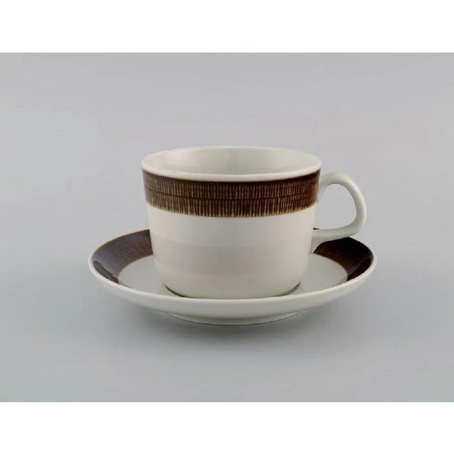 Hertha Bengtsson 1917-1993 for Rörstrand. Four Koka teacups with saucers in glazed stoneware. 1960s. The teacup measures:...