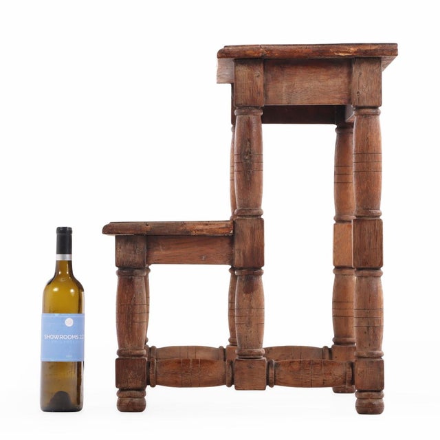 This antique, sturdy two-step stool has a decorative turned structure. The steps are in good condition and have a rich,...