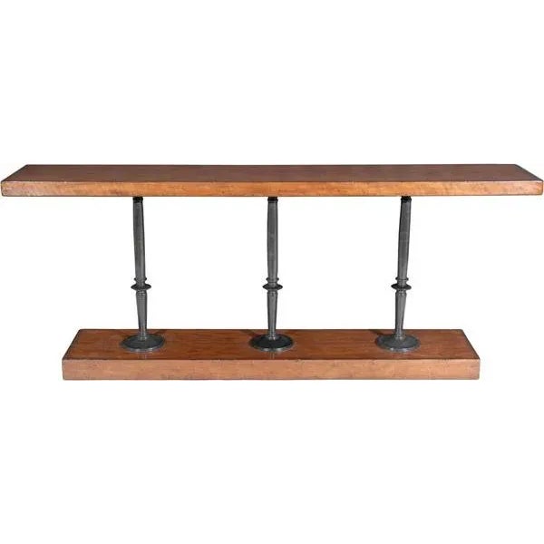 A cherry wood console table, the rectangular top and undertier joined by three verdigris brass candlestick columns in a...