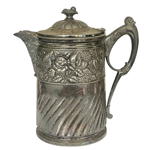 Stunning large antique insulated water pitcher by Meriden Britannia Company, dated 1868. This Victorian-era carafe is...