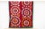This colorful vintage Suzani tapestry hails directly from Uzbekistan. The background boasts a luxurious brick red hue, a...