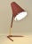 A very simple but yet beautiful red painted metal and brass table lamp, manufatcured in the late 1940´s in sweden by...