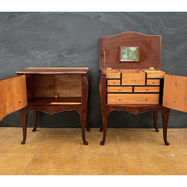 Elegant pair of French Louis XV style bedside tables, Mid 20th century. These finely shaped pieces feature bombe fronts,...