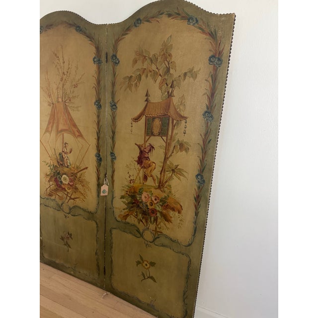 19th c chinoiserie screen/ room divider. Predominantly green and beige coloring. 3 panels, nail head details. Beautiful...