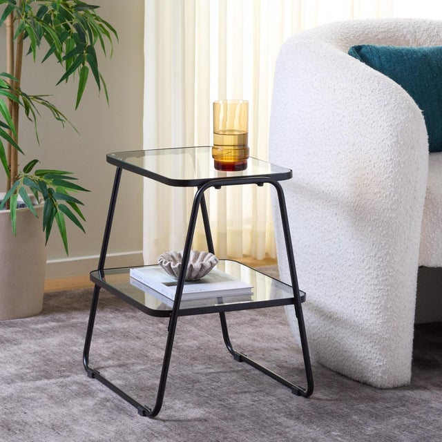 Step up your interior decor game with our Accent Tables. Stylishly crafted from sturdy iron and tempered glass, these...