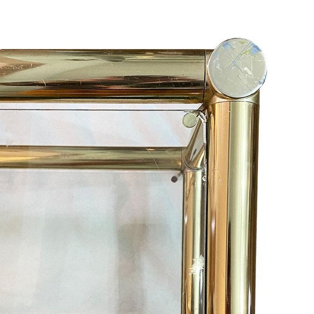 This brass console table will bring a Mid Century flair to any living room. At 50" wide, the sofa table can accommodate a...