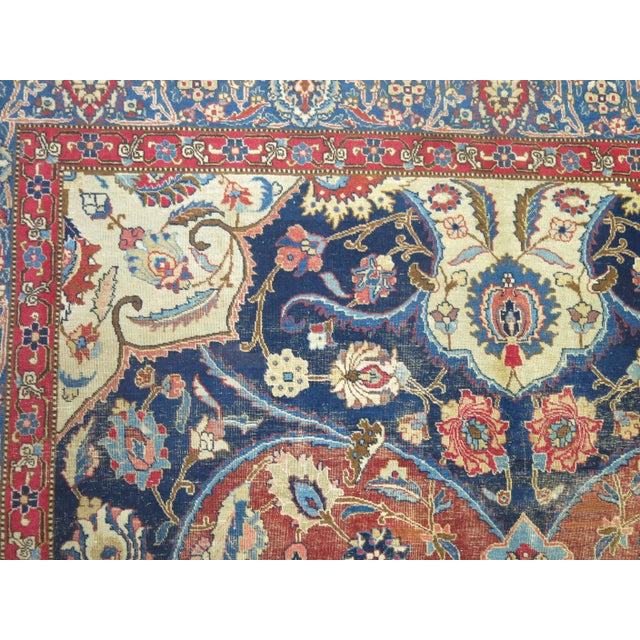 an early 20th century room size hand-knotted one of kind Persian tabriz rug with a formal dramatic masculine design....