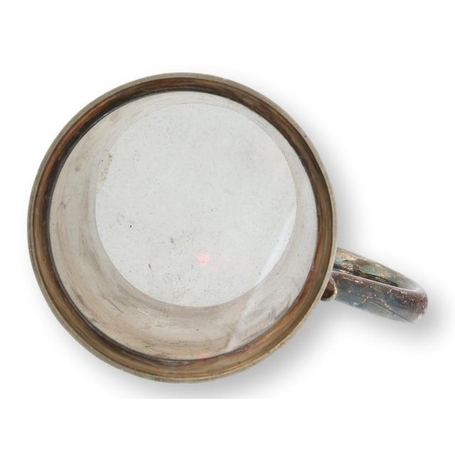 An engraved 1937 English sporting trophy cup presented for the Men's Squash Rackets Club Autumn Handicap. Retaining its...