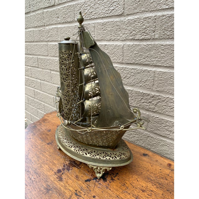 An unusual and beautifully detailed mid-20th century German brass sailing ship nightlight that effortlessly bridges...