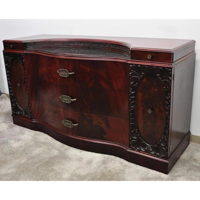 Vintage Chinese Chippendale Mahogany Serpentine Triple Dresser Credenza with Mirror. Item features a small mirrored...