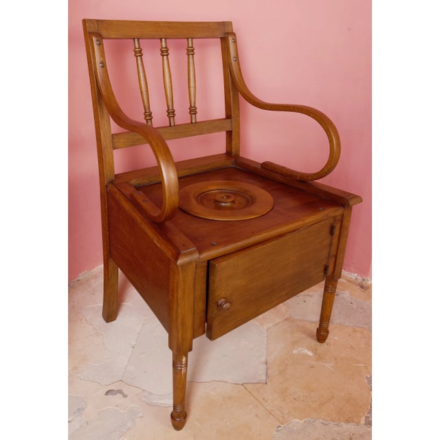 Antique toilet chair made of solid beech, originating from Belgium and dating from around 1920. This is a practical and at...