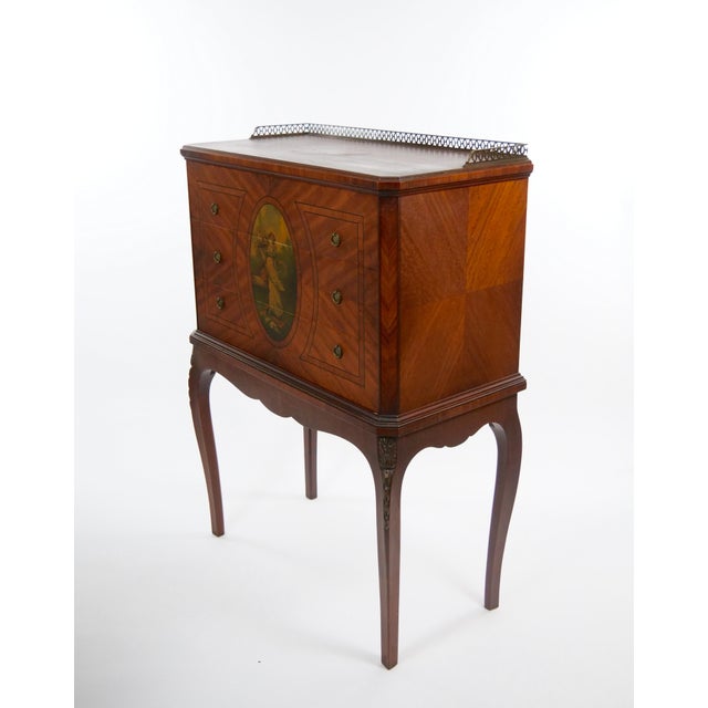 Elegant antique silverware cabinet in the Adam style, distinguished by its refined neoclassical design, symmetrical...