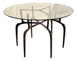 Sculptural Antique Bronzed Iron Legs Round 48” Glass Top Cyrano Dining Table by Made Goods