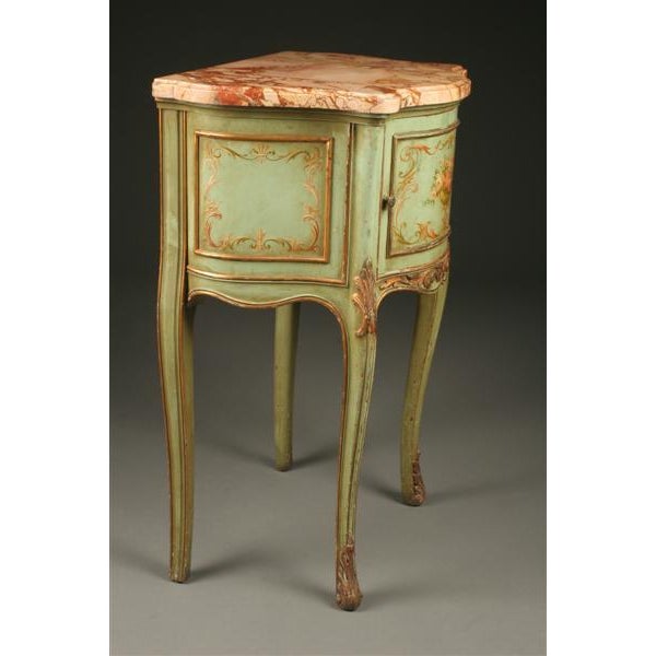 Beautiful late 19th-century French commode featuring a decorative polychrome finish, an elegant serpentine front, and a...
