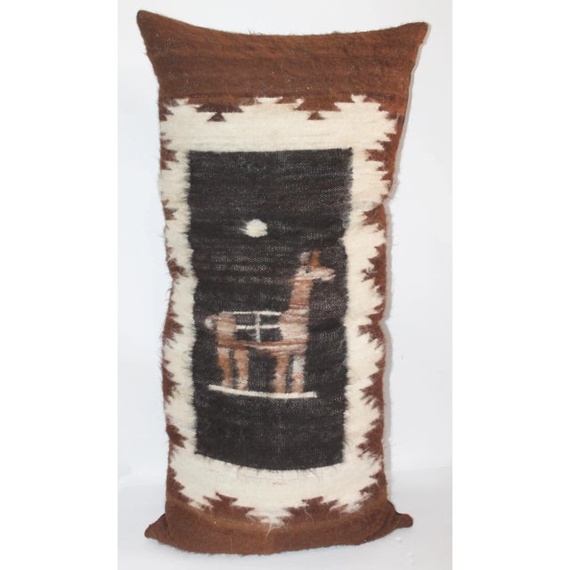 Wool pictorial pillow showing image of a llama with linen backing, down and feather insert and zipper closure on bottom.