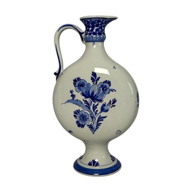 Vintage hand-painted Delft Blue handled vase by Royal Delft / De Porceleyne Fles, made in Delft in 1975. The vase has a...