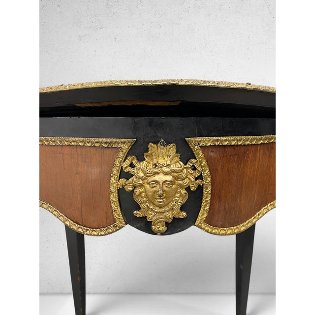 Rare 19th century antique Napoleon III (c. 1860-1880) center table with a dramatic serpentine silhouette, black lacquered...