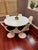Iconic Tulip table with metal base and 6 chairs. Recently painted. Chairs have a metal base and acrylic seating with black...