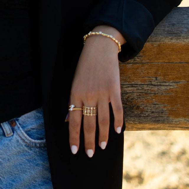 Radiate brilliance with the Diamond Teardrop Glow Gold Adjustable Ring. Designed with two dazzling teardrop-cut diamonds,...