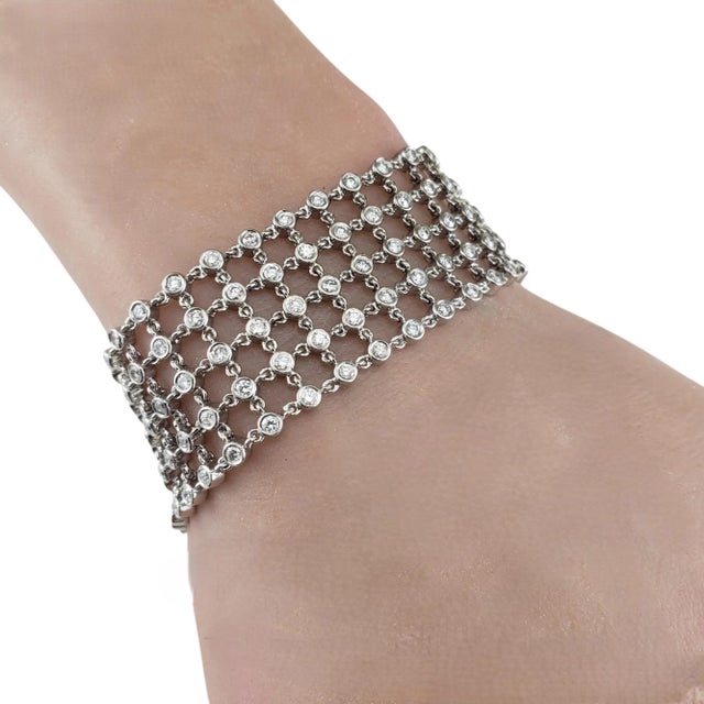 18 Karat White Gold Diamond 5 Row Mesh Bracelet- This stunning flexible mesh bracelet features white (199) and champagne...