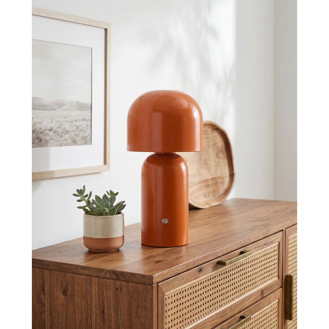 Illuminate your space with the Umbra accent table lamp, a beacon of minimalist modern style. Standing at a sleek 10 inches...