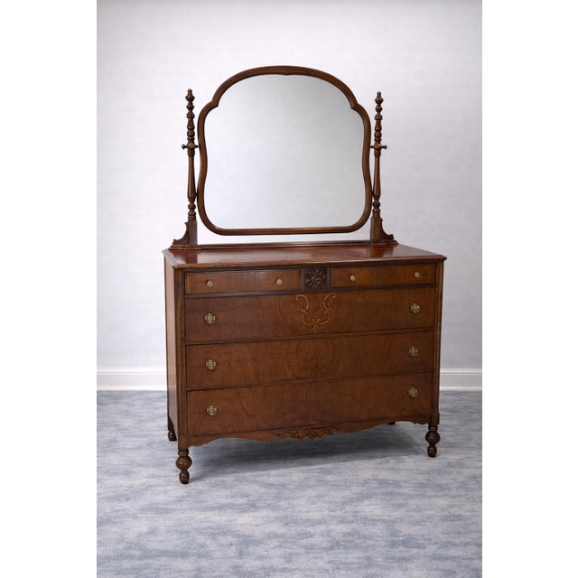 Early 20th Century Mahogany Dresser with Mirror This elegant early 20th-century dresser is crafted in richly toned...