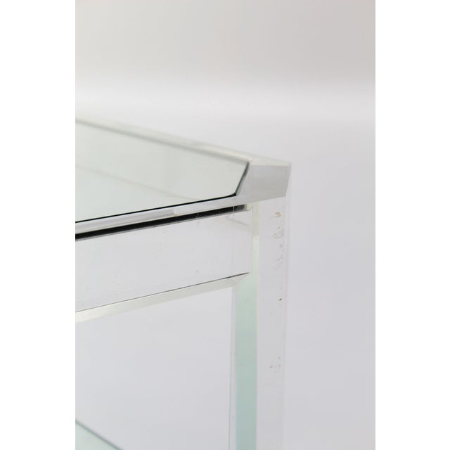 Rare rectangular coffee table attributed to French designer David Lange, circa 1970s. Thick acrylic glass structure with...