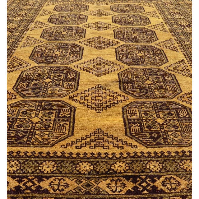 This Turkomen Ersari rug has been hand-knotted in the finest wool. The rug features an all-over repeating Gul design...