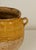 19th Century French Provincial confit pot with twin handles. Ochre yellow glazed upper half, unglazed terracotta lower body.