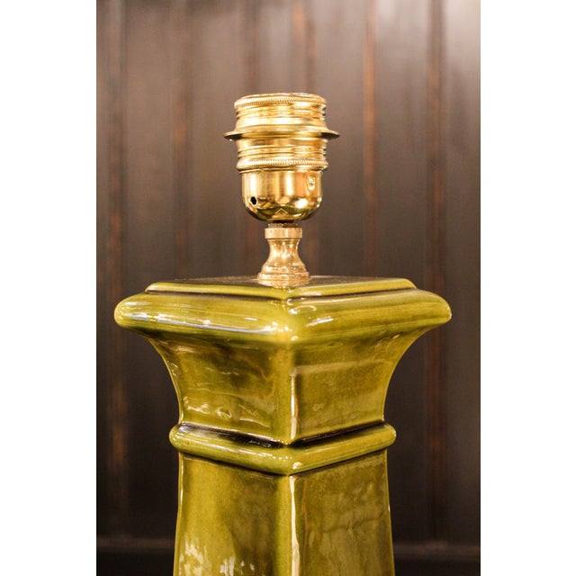 Green glazed ceramic table lamp from Manises. Its architectural lines and elegant proportions give it a striking presence....