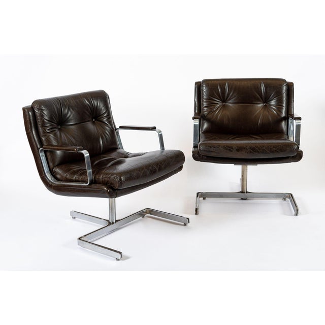 This stunning pair of vintage mid century modern lounge chairs were designed by Raphael Raffel and made in France circa...