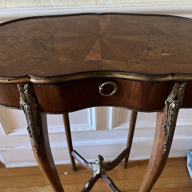 Wooden Louis XV style kidney shaped wooden tables with brass details. Perfect side tables or decorative tables.