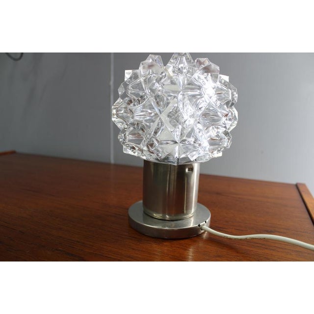 Distinctive mid century table lamp produced in czechoslovakia during the 1970s, originating from the renowned glassmaking...