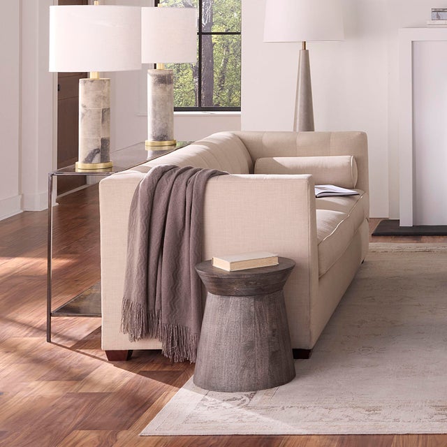 Shaped with gentle curves and a grounded silhouette, this handcrafted mango wood side table brings natural warmth and...