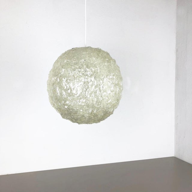 Article: Bubble hanging light Origin: Germany Age: 1970s This hanging light was designed and produced in Germany in the...